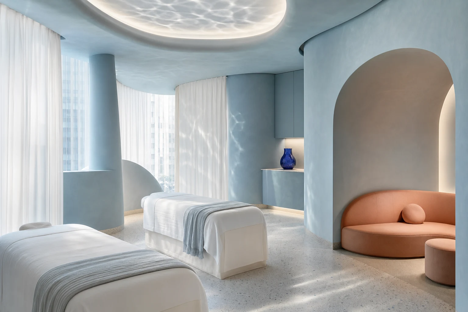 Airy mineral-blue massage studio with curved walls