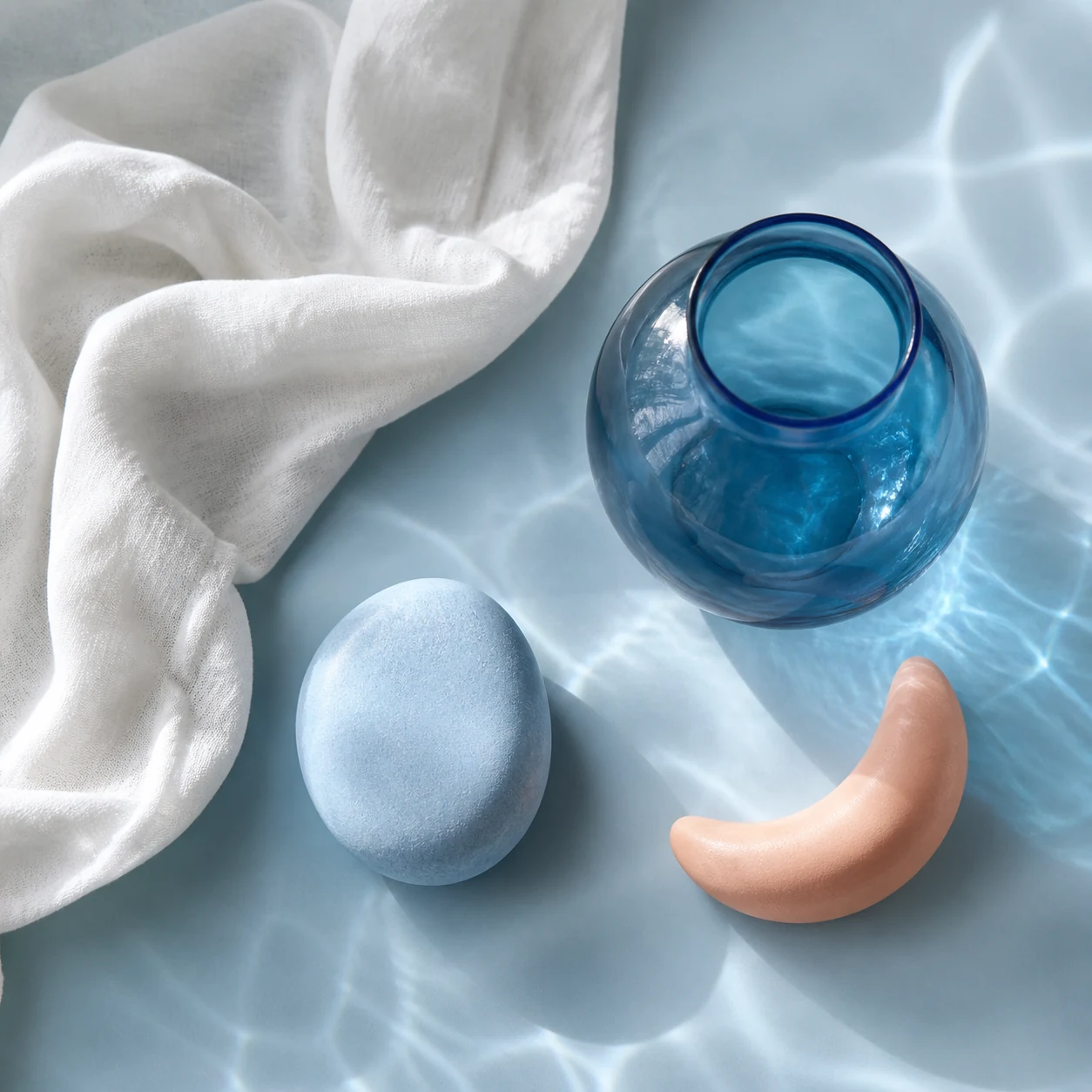 Blue glass, soft linen and sensory massage objects